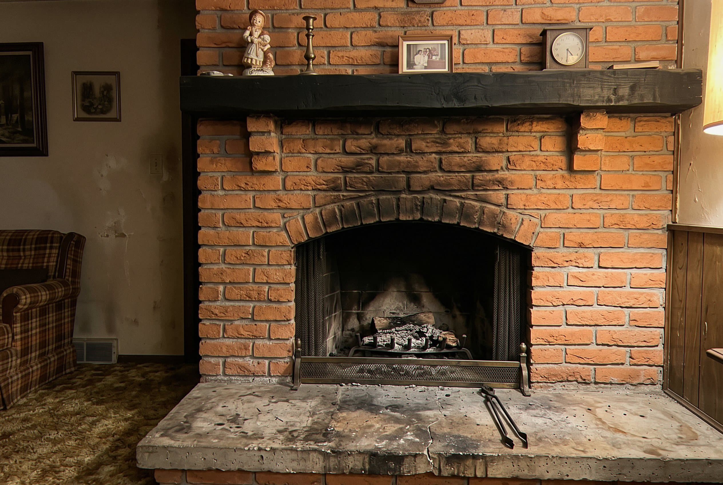 Dated fireplace tile surround before our rebuild